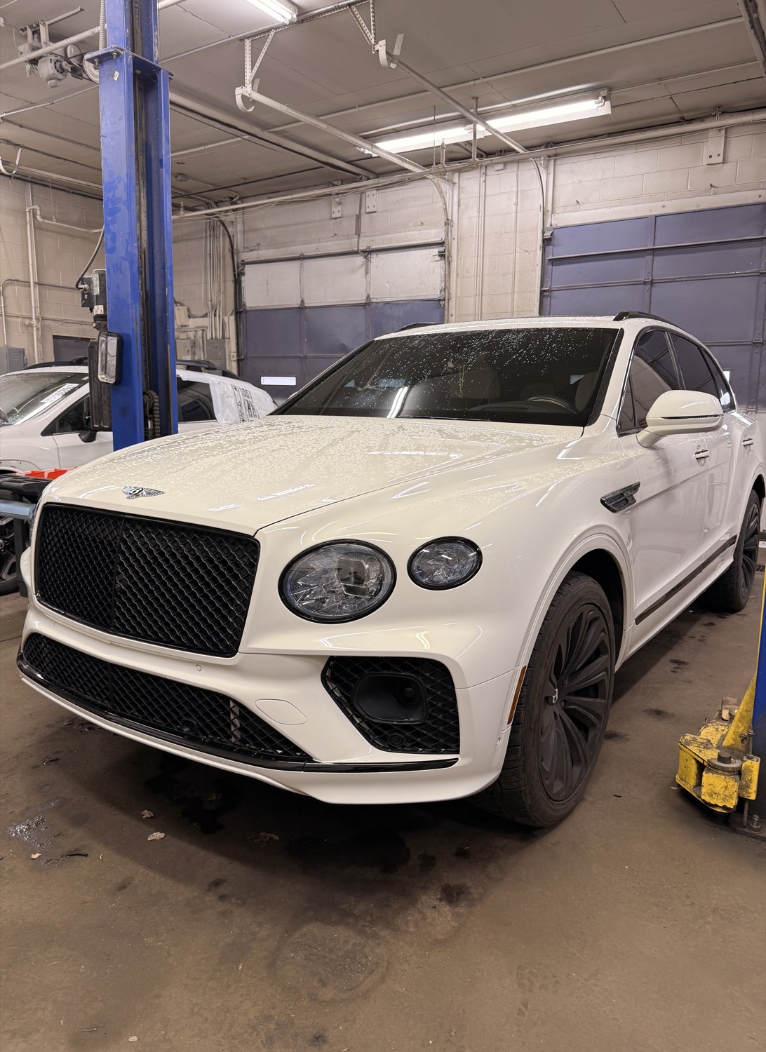 Bentley Bentayga on the lift for repair